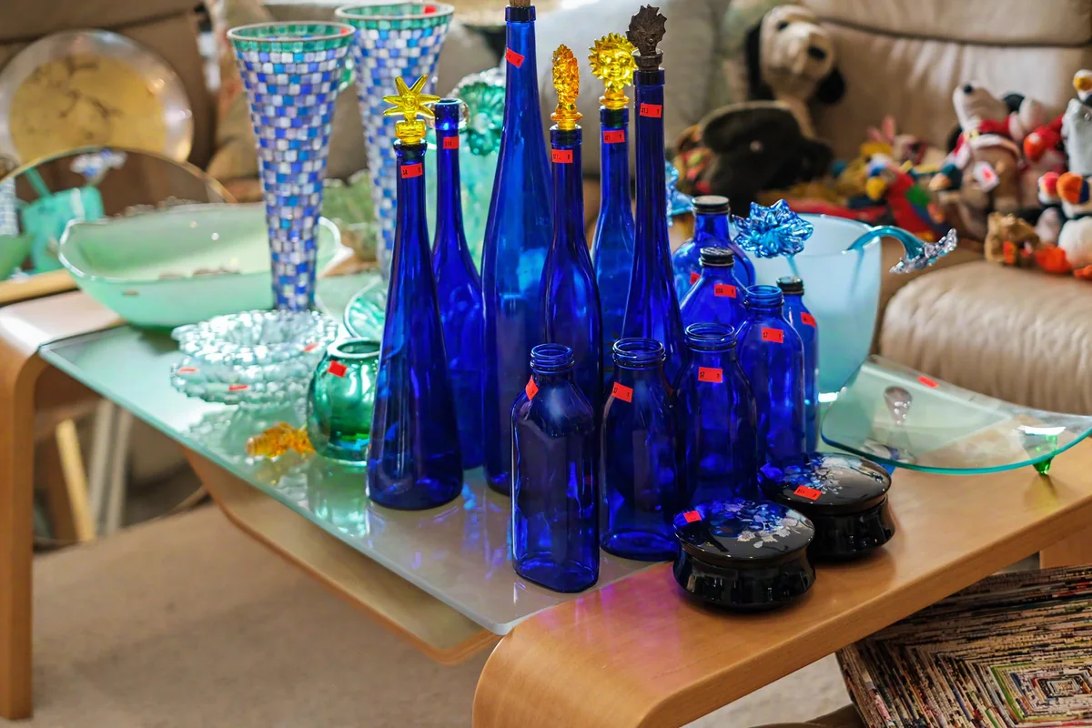 Blue glass collection photographed at a 916 Estate Sales event